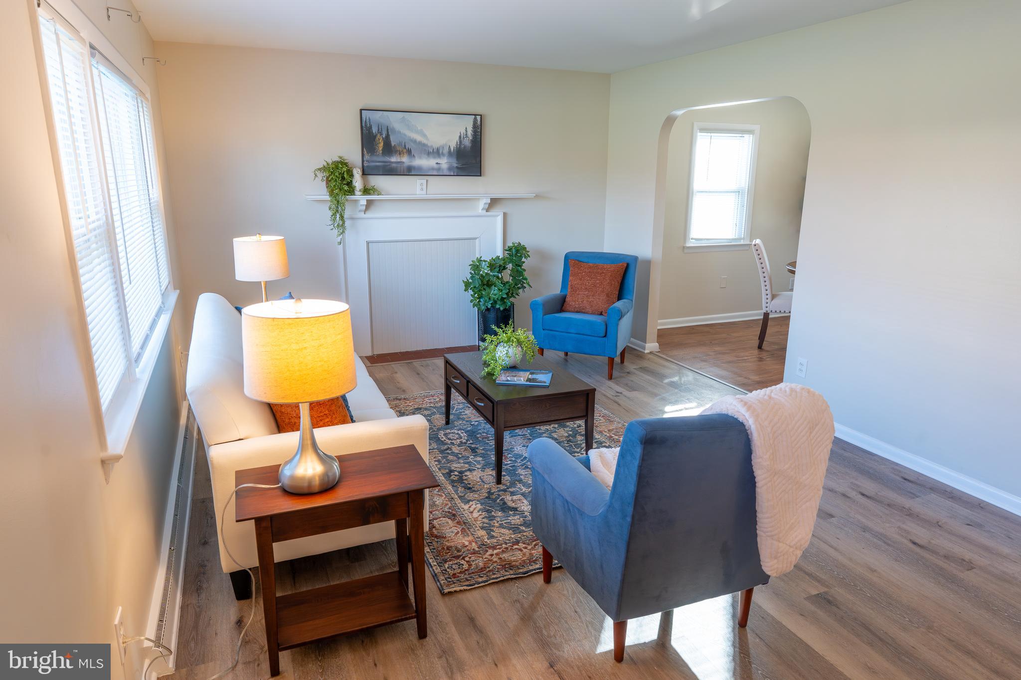 1110 Rohrerstown Road Lancaster, PA 17601 - Photo 10 of 35 a living room with furniture and a lamp