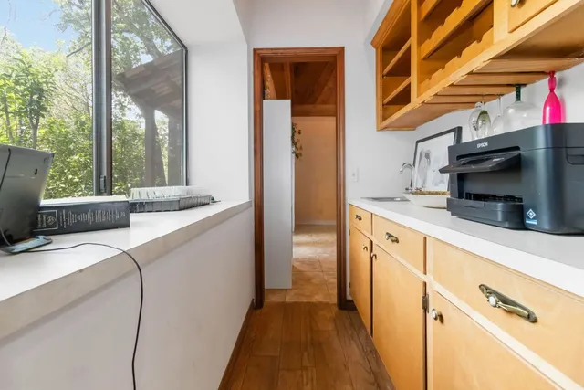 a kitchen with a sink and a refrigerator