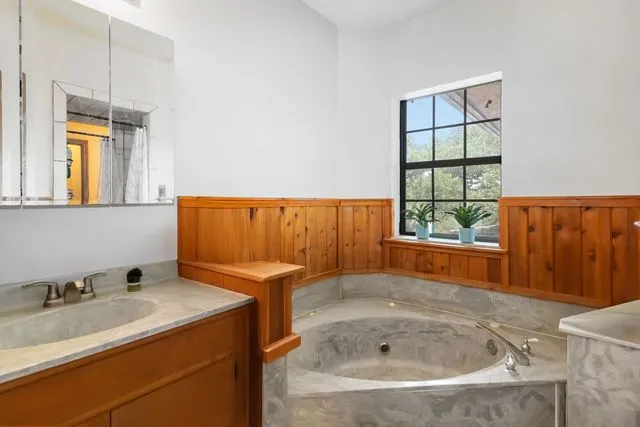 a bathroom with a sink and a bathtub