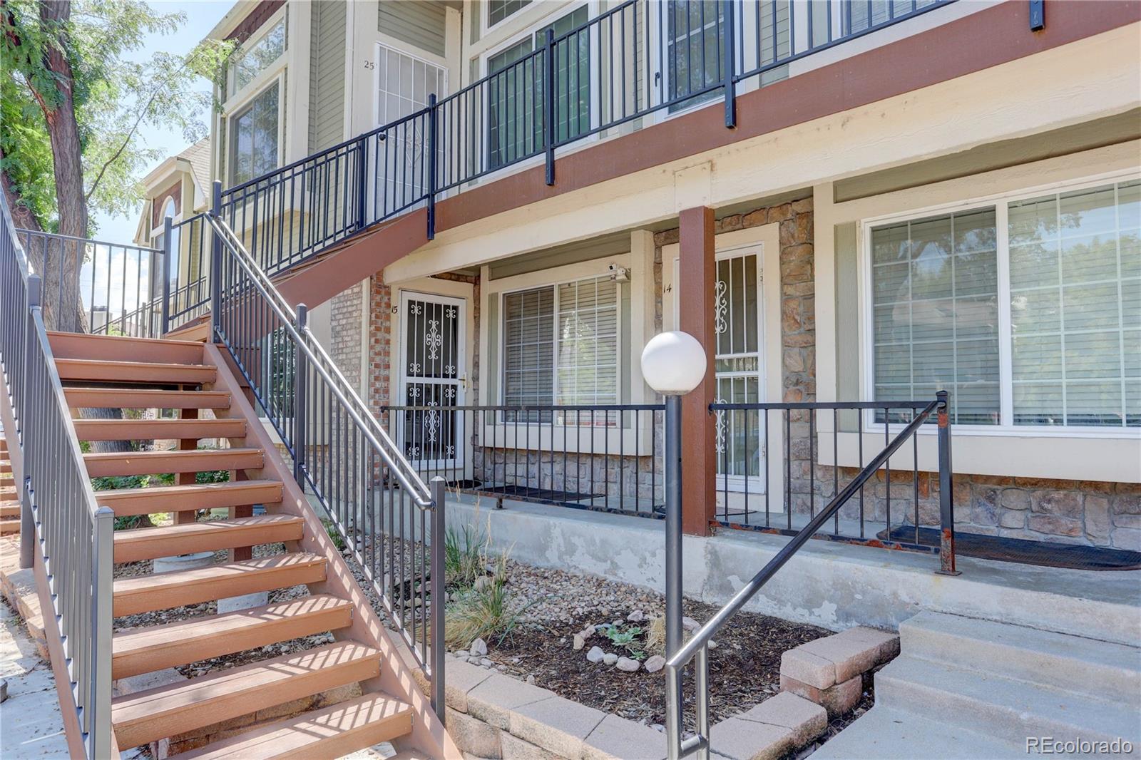 1885 South Quebec Way, Unit C15 Denver, CO 80231 - Photo 1 of 31 a view of staircase with wooden floor and a potted plant