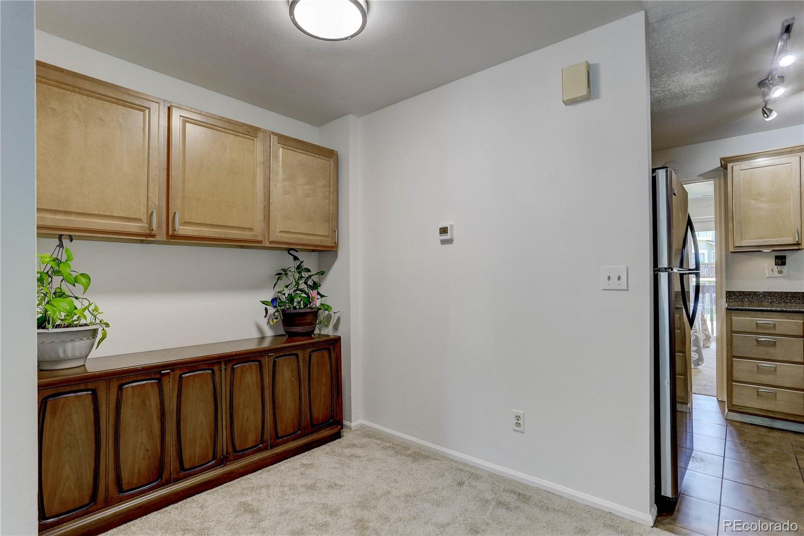 1885 South Quebec Way, Unit C15 Denver, CO 80231 - Photo 11 of 31 a view of entryway with wooden floor