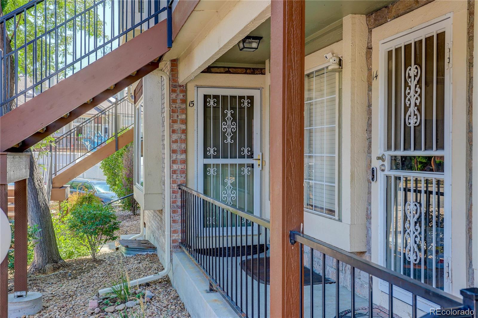 1885 South Quebec Way, Unit C15 Denver, CO 80231 - Photo 4 of 31 a view of a porch with a floor to ceiling window