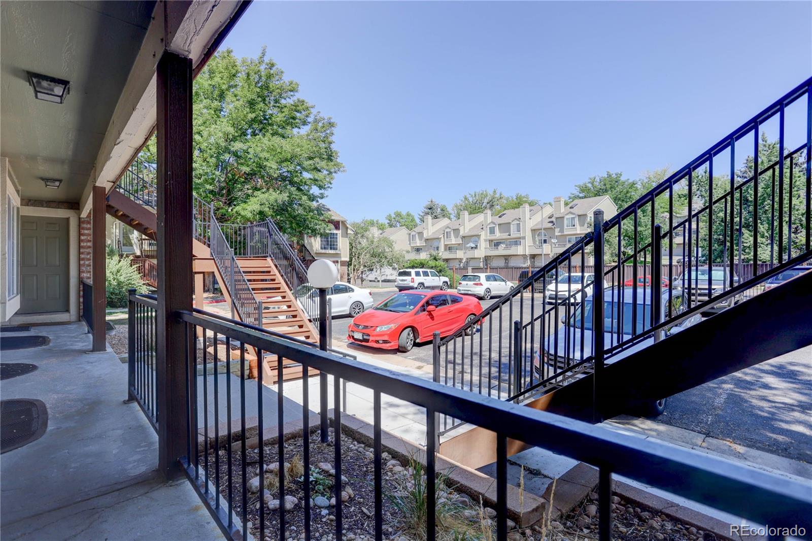 1885 South Quebec Way, Unit C15 Denver, CO 80231 - Photo 5 of 31 a view of a balcony with wooden stairs