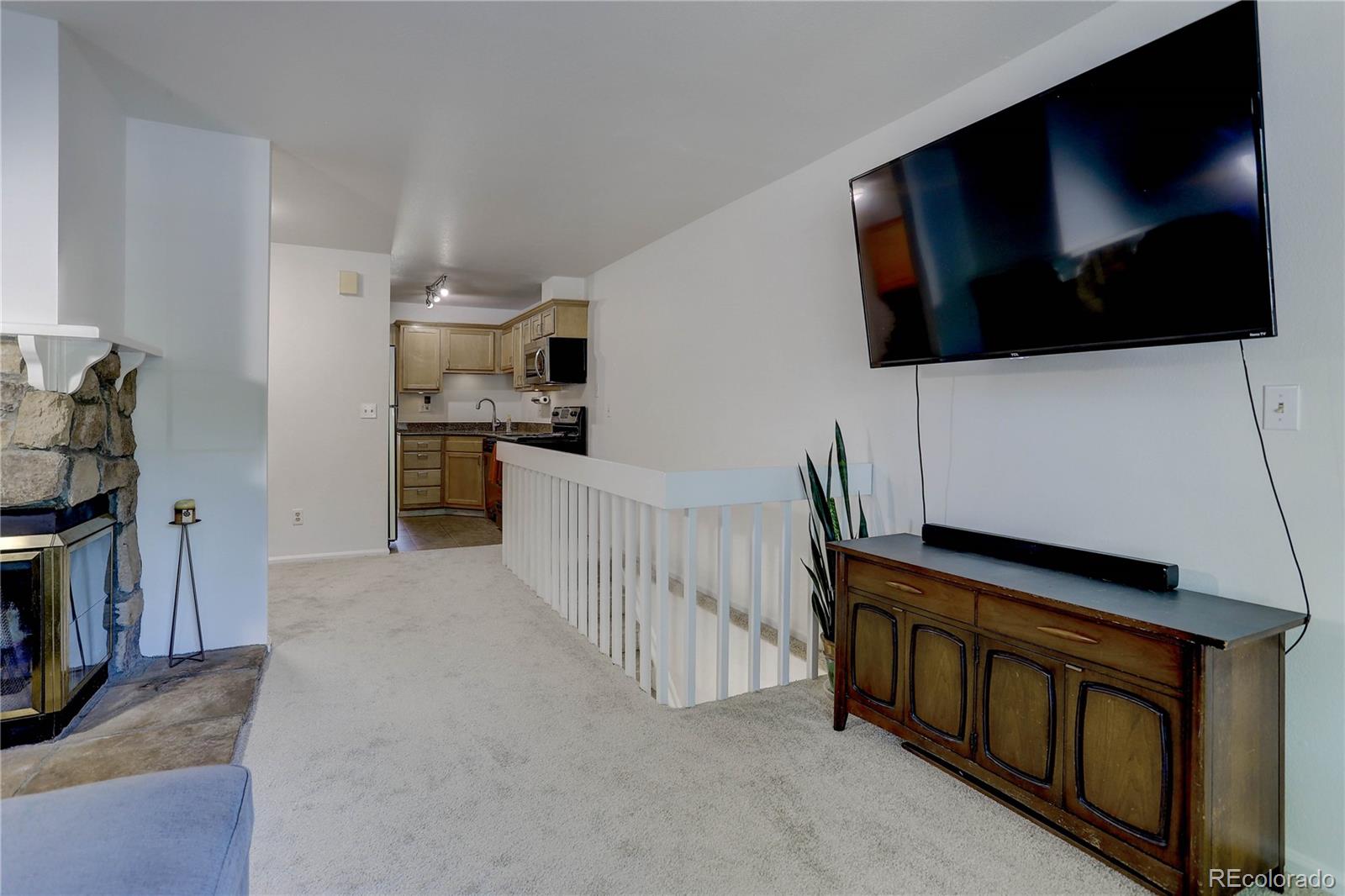 1885 South Quebec Way, Unit C15 Denver, CO 80231 - Photo 7 of 31 a view of a living room washer and dryer