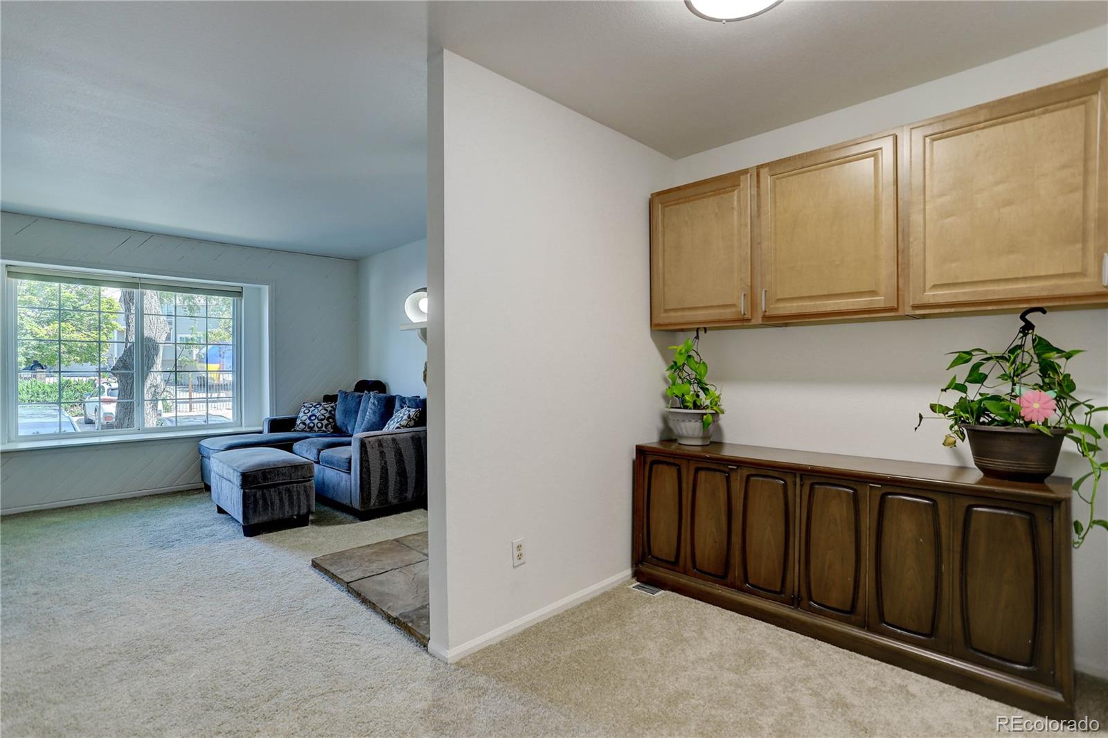 1885 South Quebec Way, Unit C15 Denver, CO 80231 - Photo 10 of 31 a living room with furniture
