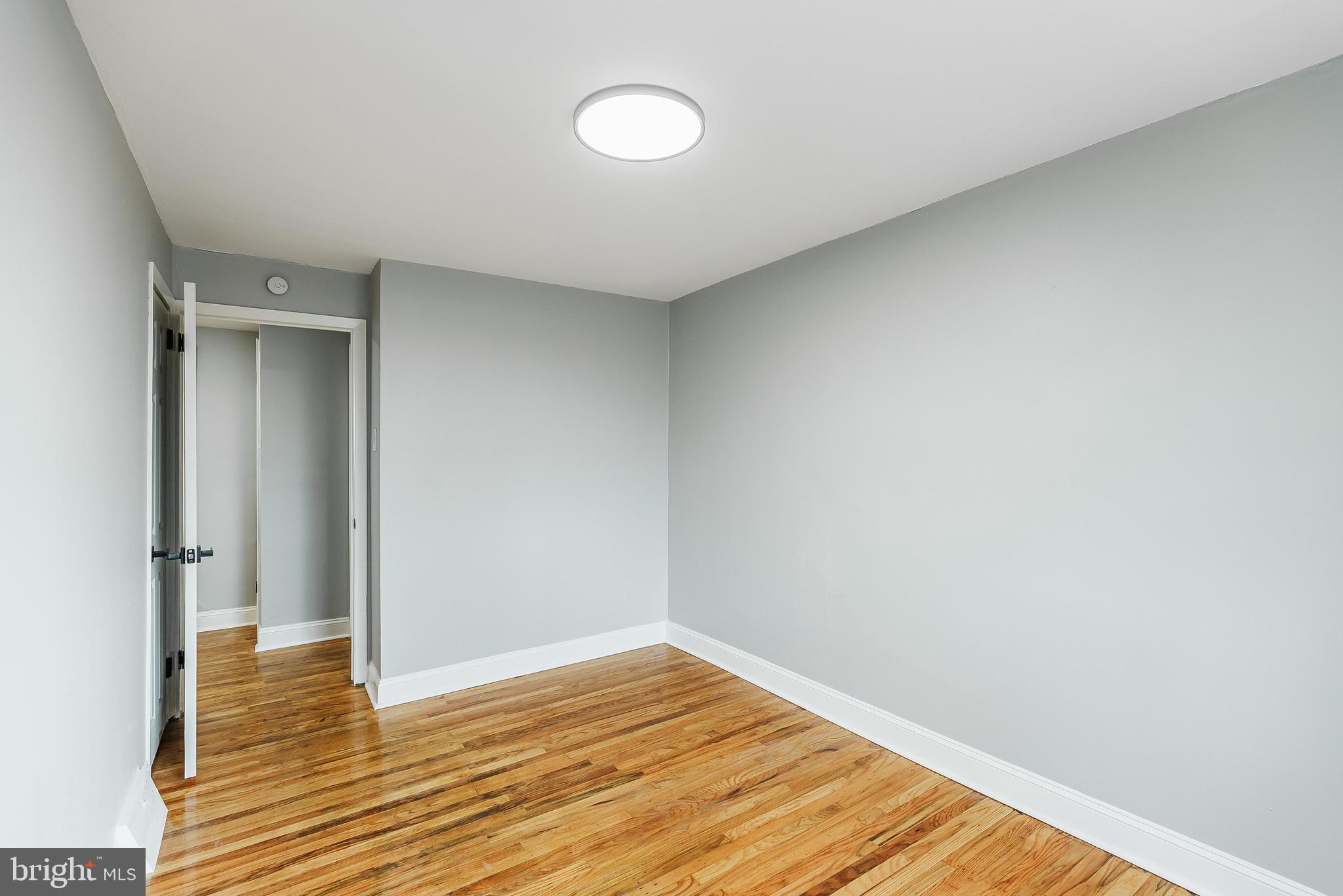 1620 Ashurst Road Philadelphia, PA 19151 - Photo 23 of 30 a view of empty room with wooden floor