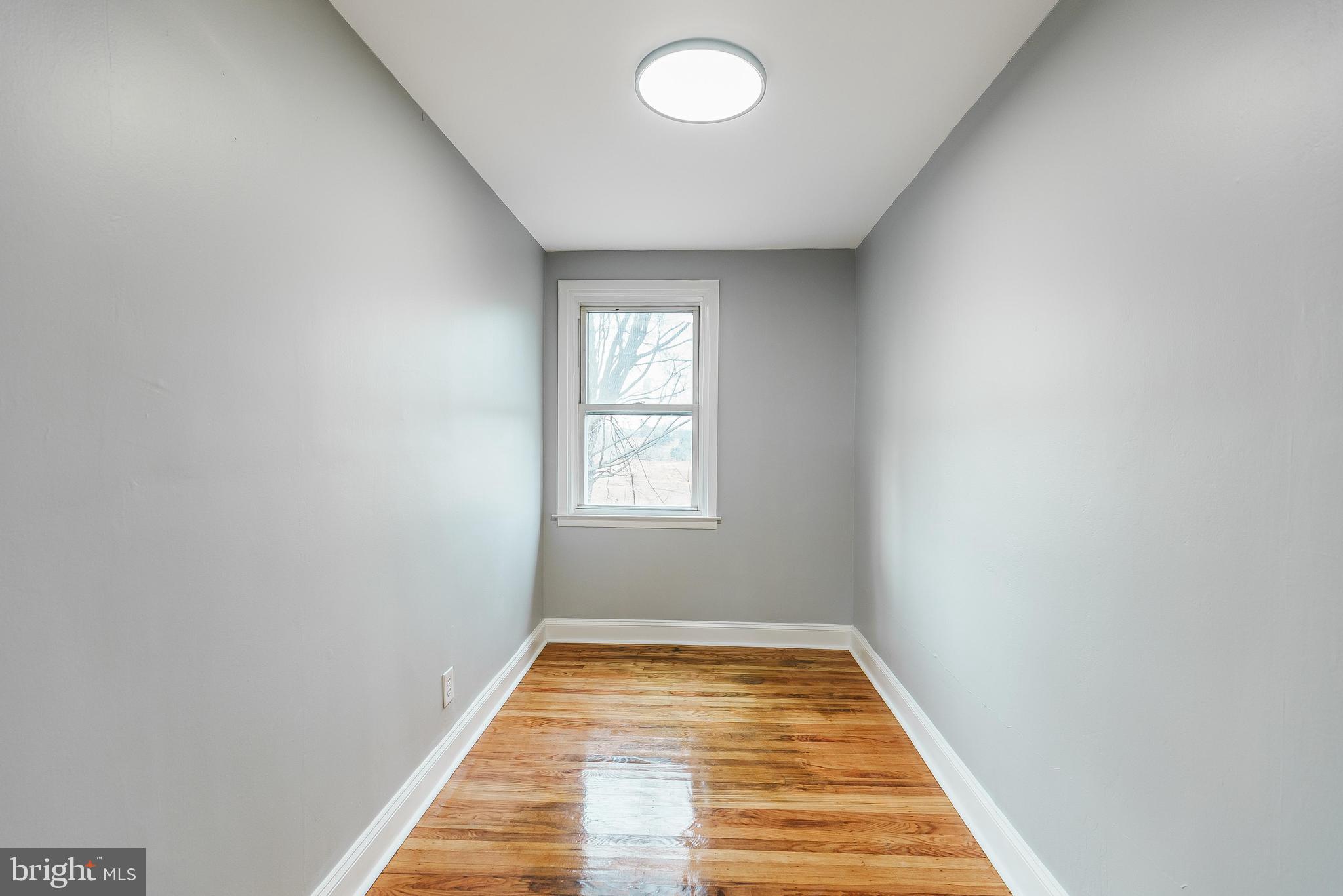 1620 Ashurst Road Philadelphia, PA 19151 - Photo 24 of 30 a view of a room with wooden floor and window
