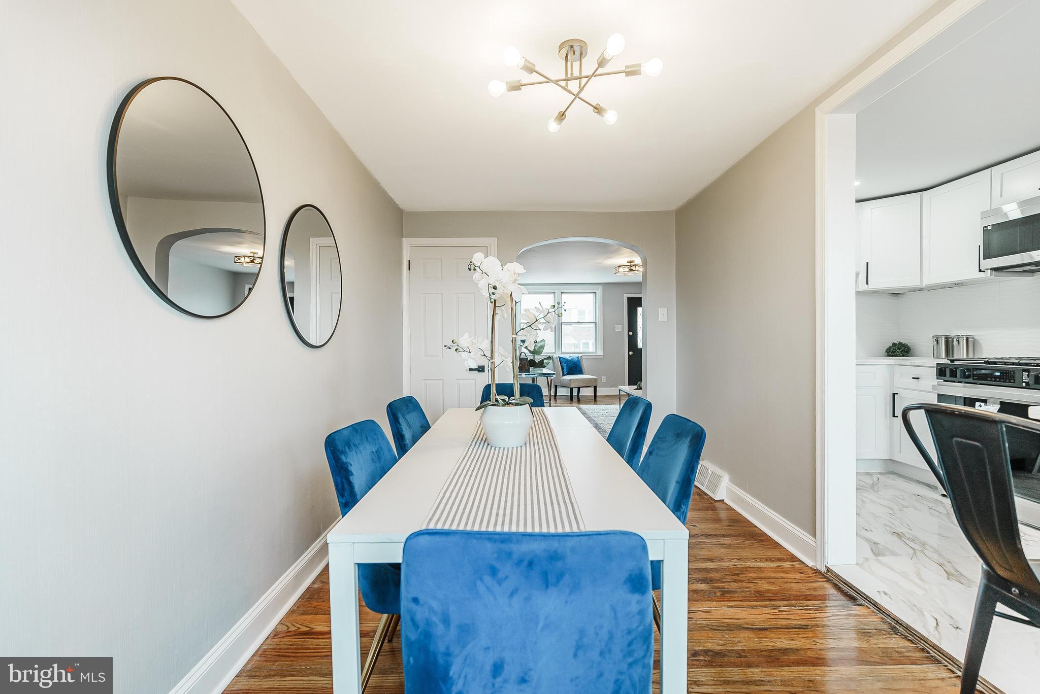 1620 Ashurst Road Philadelphia, PA 19151 - Photo 9 of 30 a view of a dining room with furniture a kitchen and wooden floor