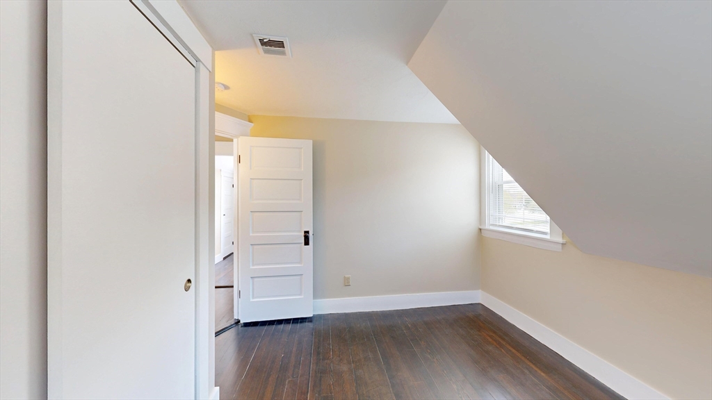 262 Plymouth Street, Unit 1 Bridgewater, MA 02324 - Photo 14 of 26 a view of a hallway with wooden floor and closet