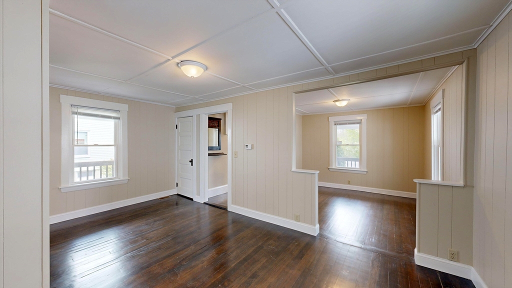 262 Plymouth Street, Unit 1 Bridgewater, MA 02324 - Photo 20 of 26 a view of empty room with wooden floor and fan