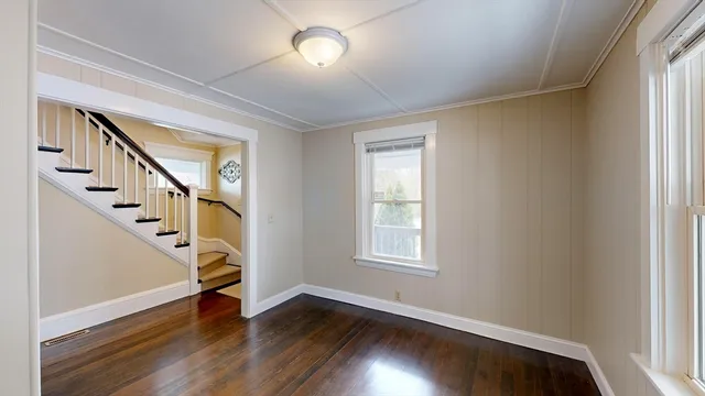 a view of an entryway with wooden floor and stairs