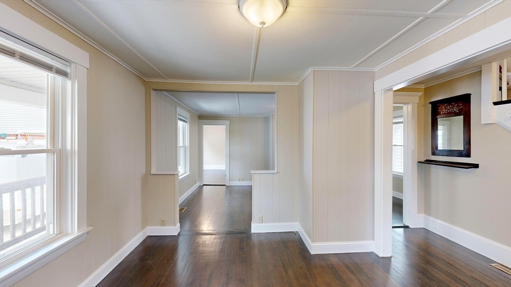 262 Plymouth Street, Unit 1 Bridgewater, MA 02324 - Photo 23 of 26 a view of a hallway with wooden floor and cabinet