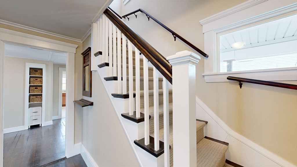 262 Plymouth Street, Unit 1 Bridgewater, MA 02324 - Photo 26 of 26 a view of an entryway with wooden floor and staircase