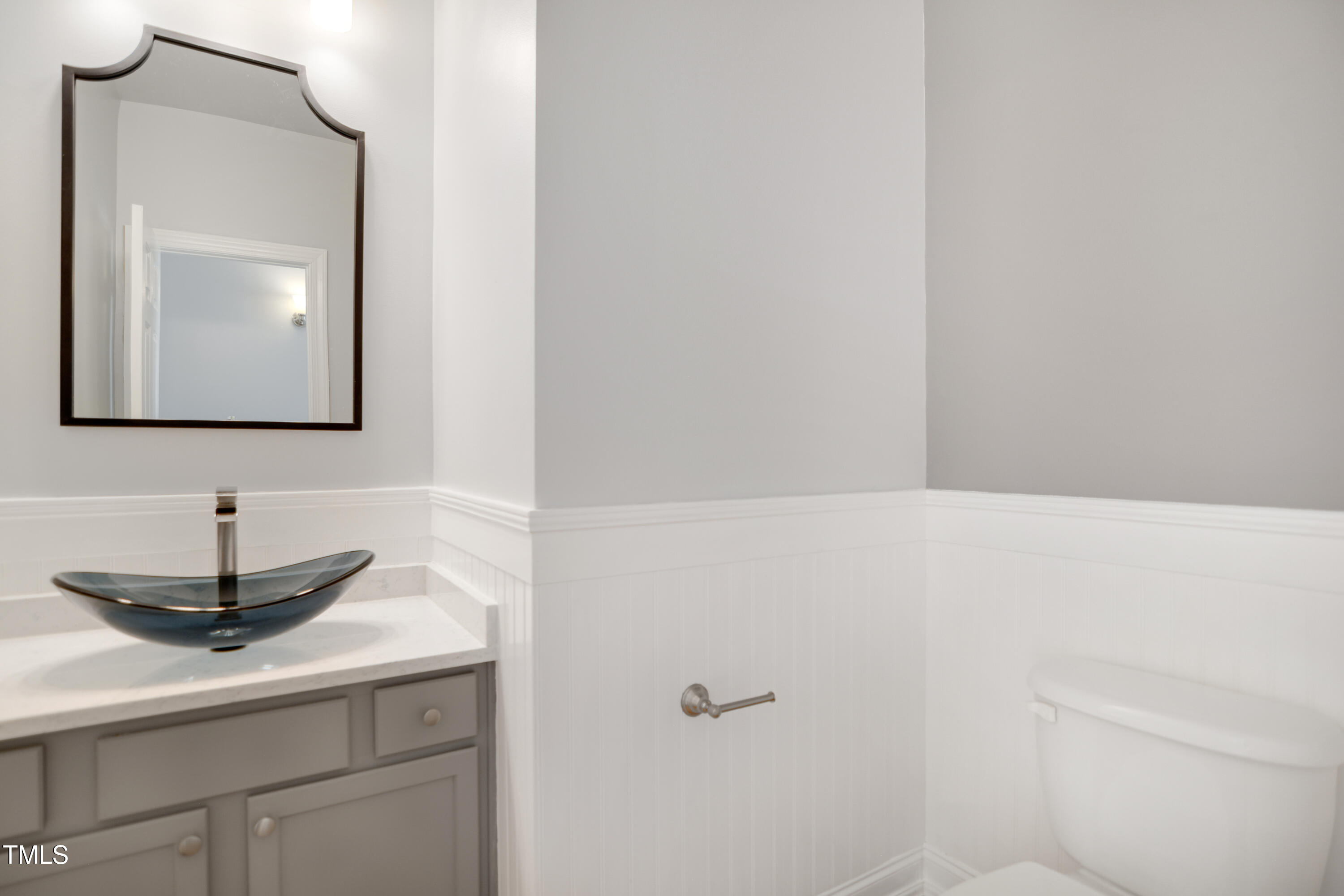 121 Homegate Circle Apex, NC 27502 - Photo 13 of 33 a bathroom with a sink and a mirror
