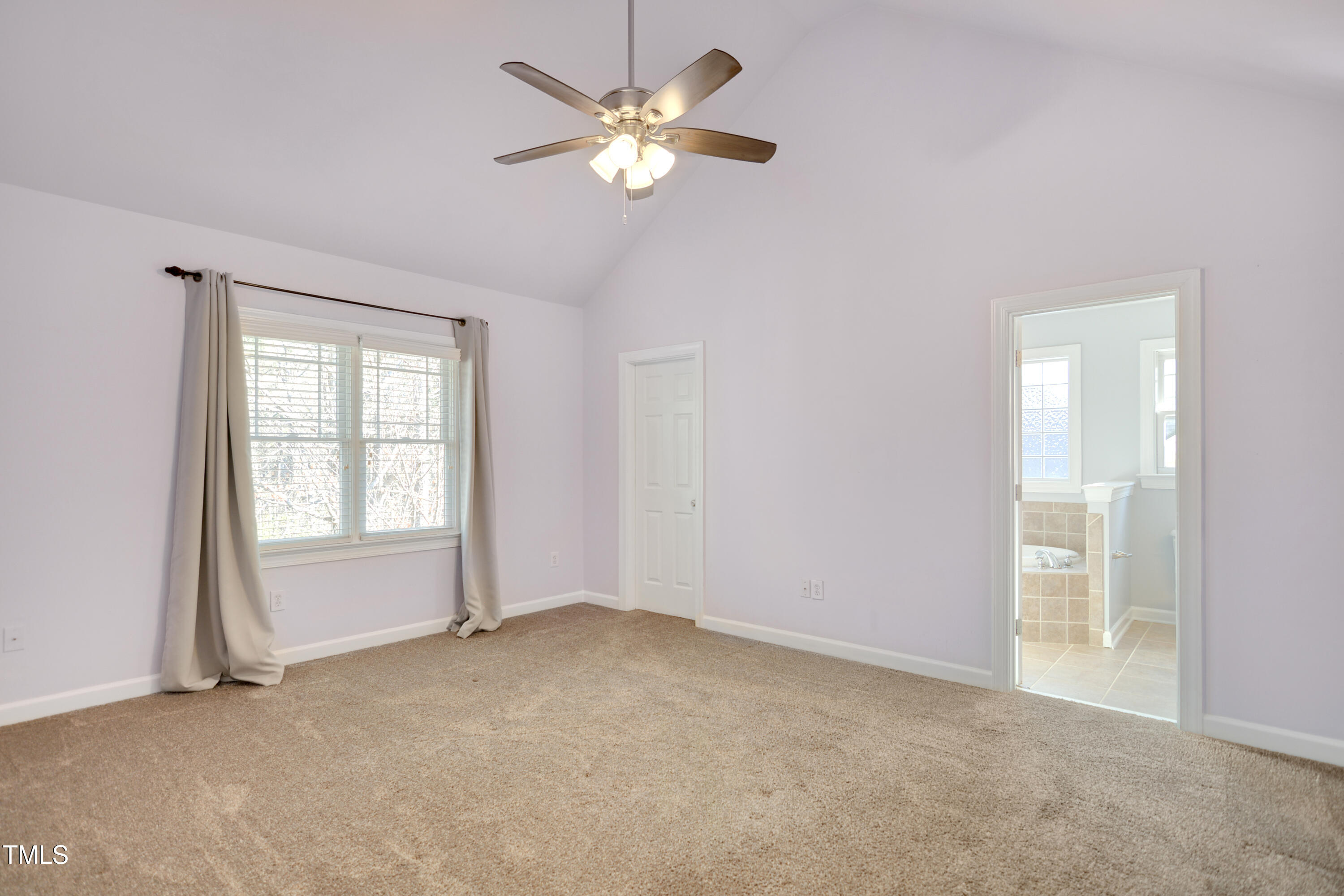 121 Homegate Circle Apex, NC 27502 - Photo 15 of 33 a view of an empty room with a window
