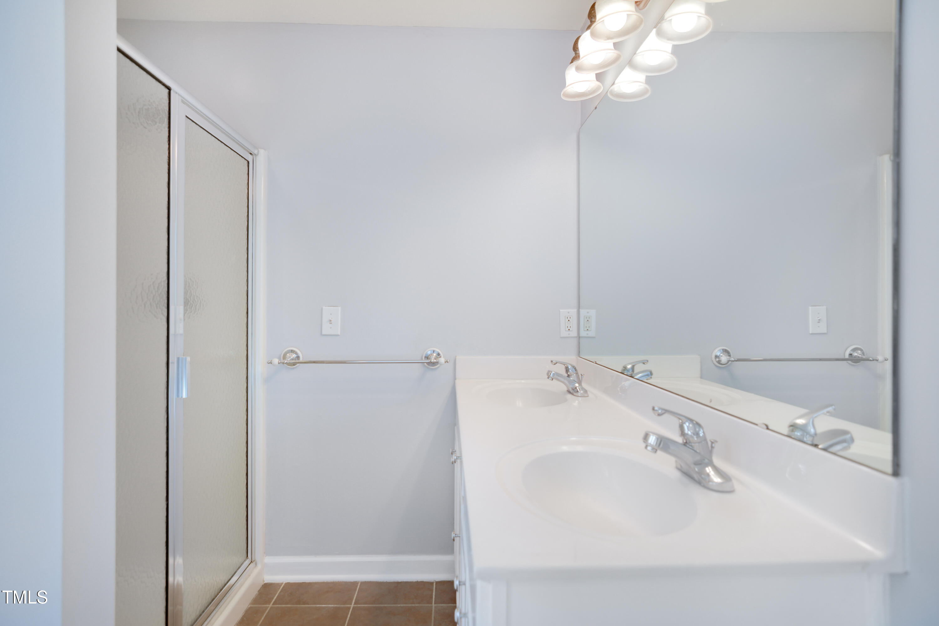 121 Homegate Circle Apex, NC 27502 - Photo 18 of 33 a bathroom with a sink and a mirror