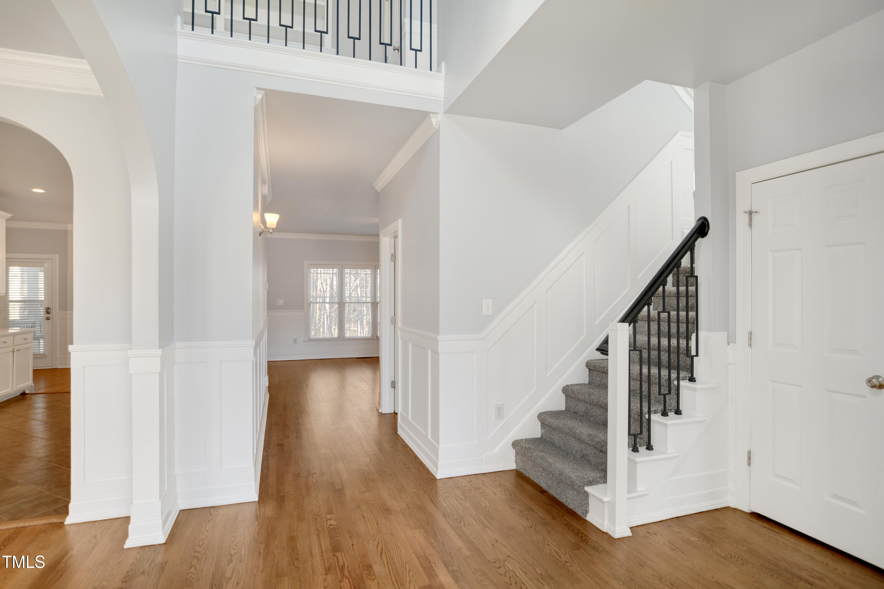 121 Homegate Circle Apex, NC 27502 - Photo 2 of 33 a view of a hallway with wooden floor and entryway