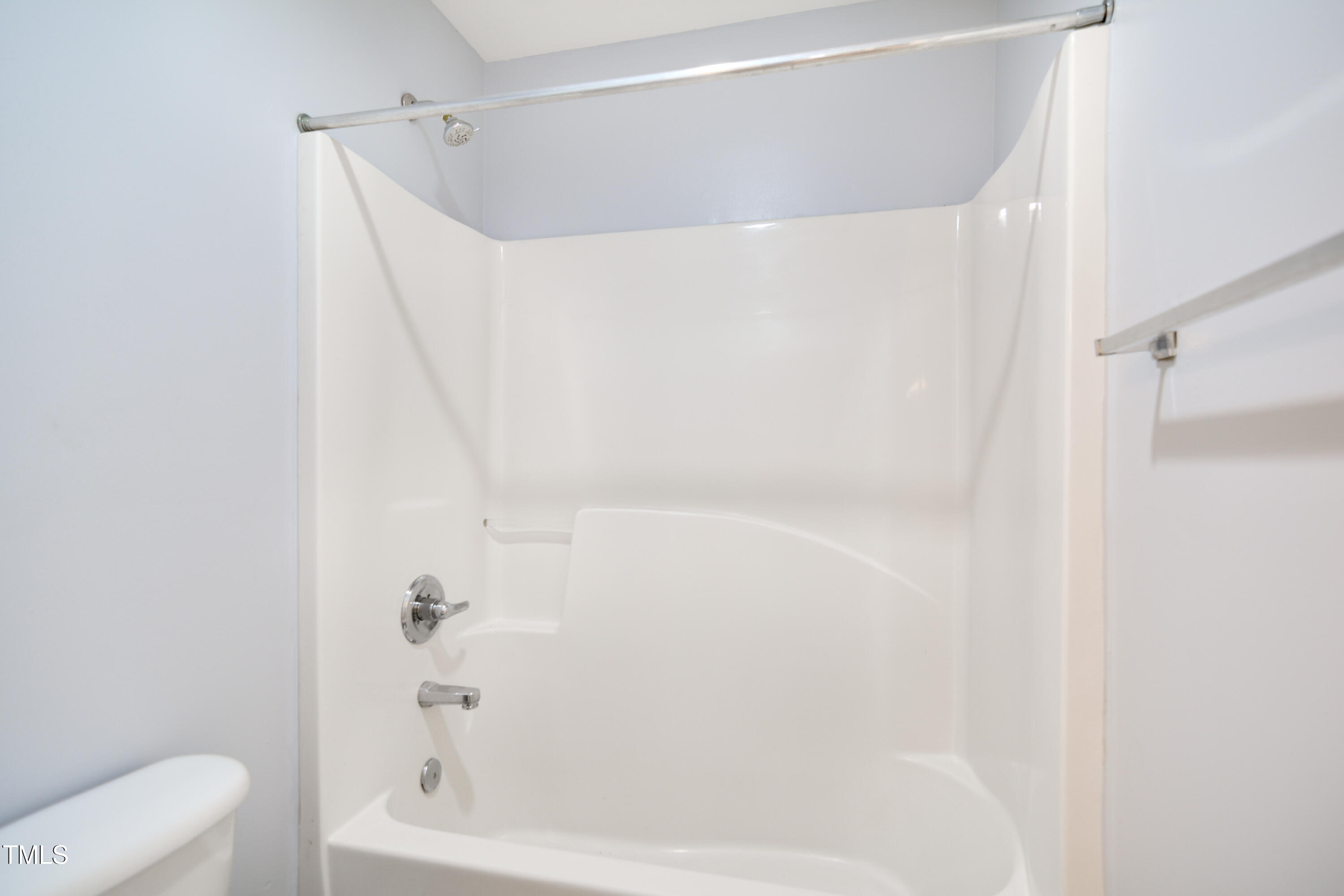 121 Homegate Circle Apex, NC 27502 - Photo 25 of 33 a bathroom with a bathtub and a shower