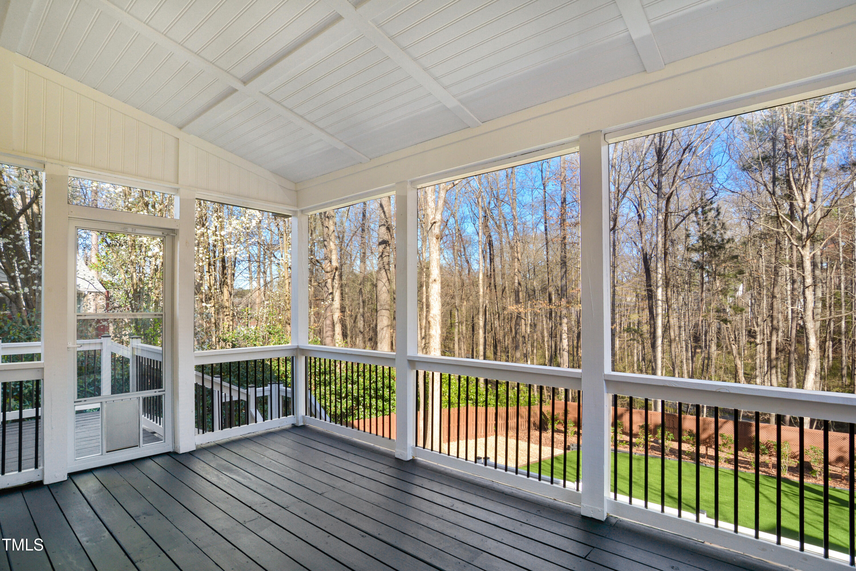 121 Homegate Circle Apex, NC 27502 - Photo 27 of 33 a view of an empty room with wooden floor and a window