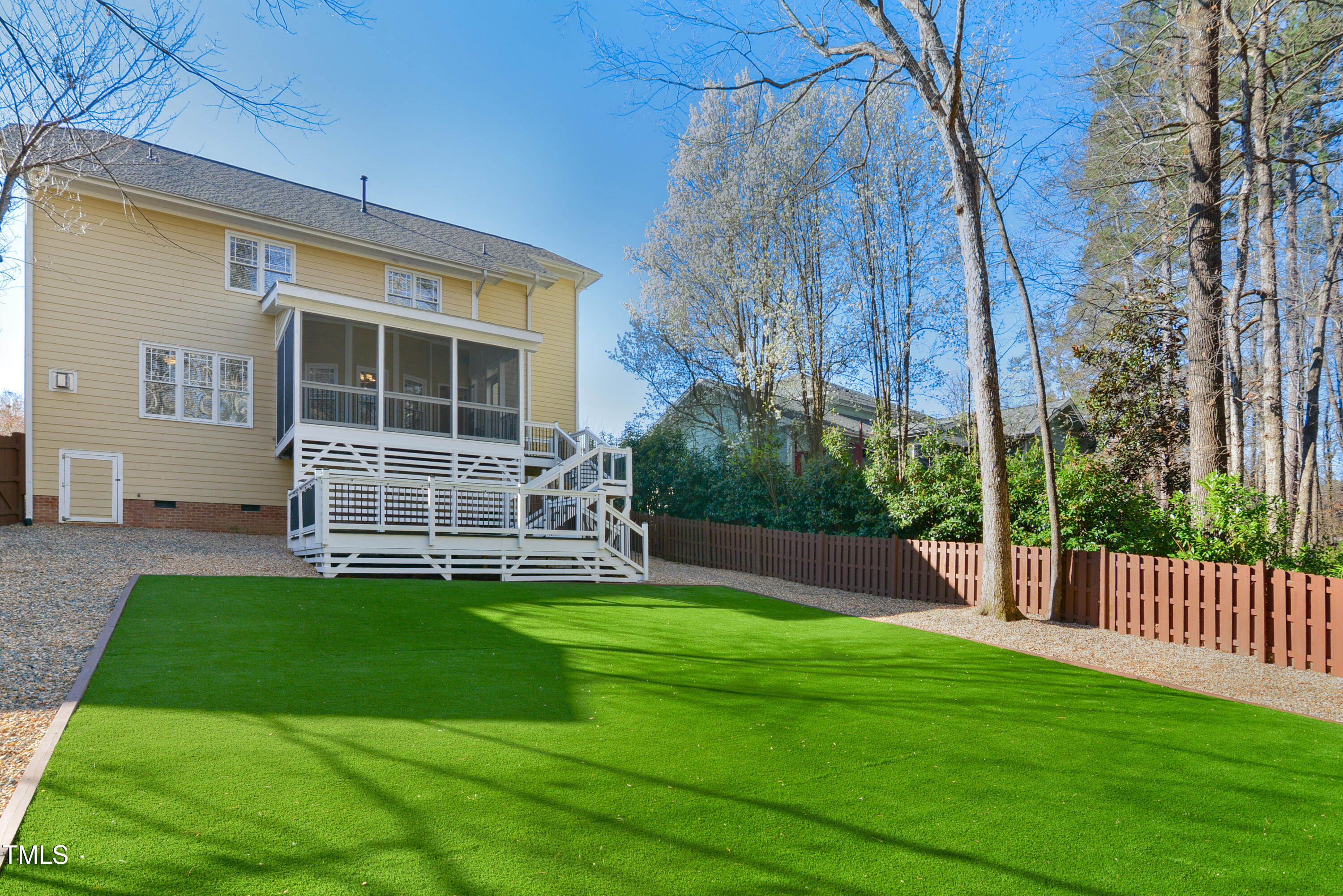 121 Homegate Circle Apex, NC 27502 - Photo 32 of 33 a view of a house with a yard and a large tree