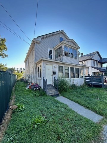 59-61 Conway Street Greenfield, MA 01301 - Photo 2 of 10 a front view of a house with a yard and porch