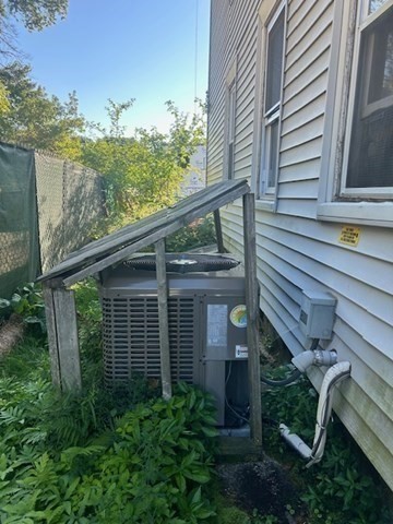 59-61 Conway Street Greenfield, MA 01301 - Photo 4 of 10 a view of a house with a window and wooden fence
