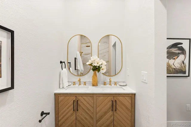 a bedroom with a bed and wall painting