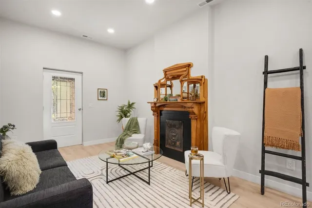 a view of a dining room with furniture and chandelier