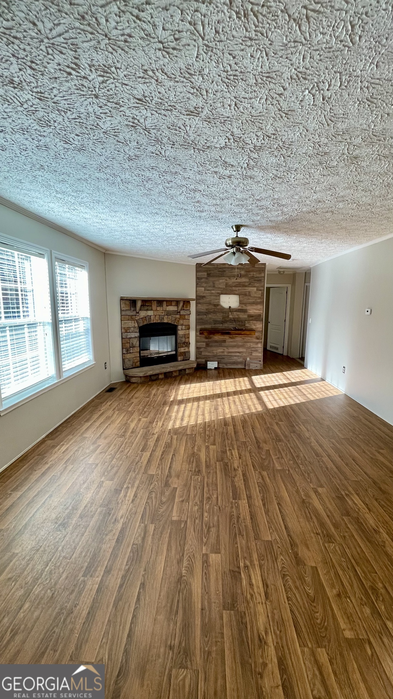 21 Ruby Road Hawkinsville, GA 31036 - Photo 12 of 43 a view of an empty room with window and wooden floor