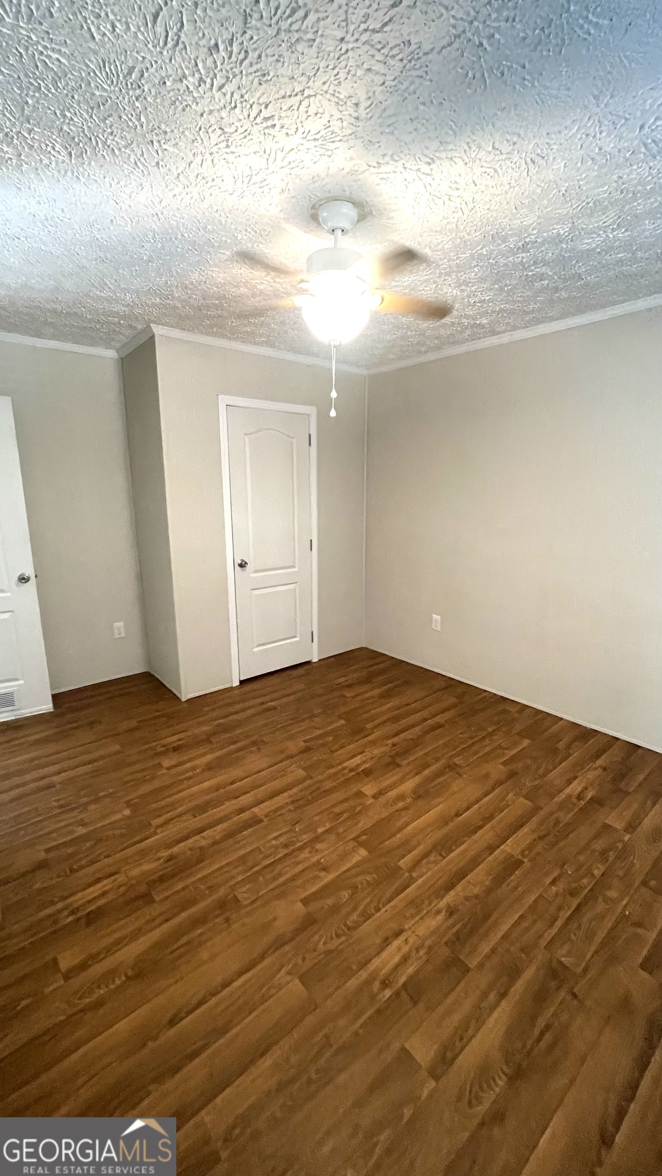 21 Ruby Road Hawkinsville, GA 31036 - Photo 33 of 43 an empty room with wooden floor and windows