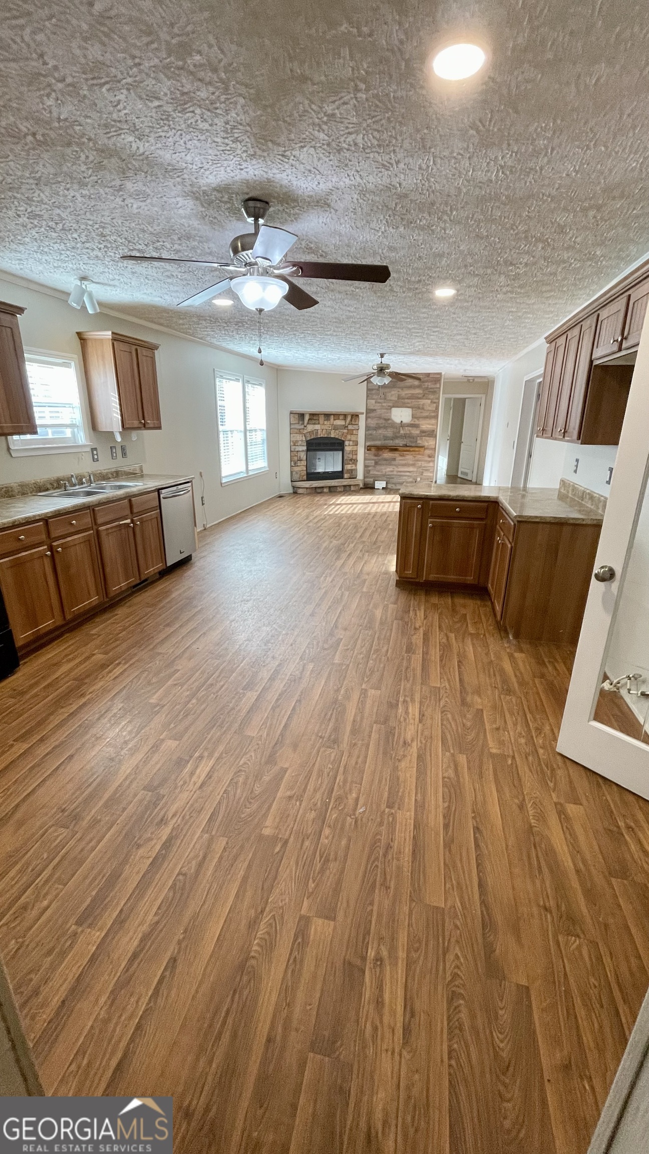 21 Ruby Road Hawkinsville, GA 31036 - Photo 9 of 43 a view of a livingroom with furniture wooden floor windows and a ceiling fan