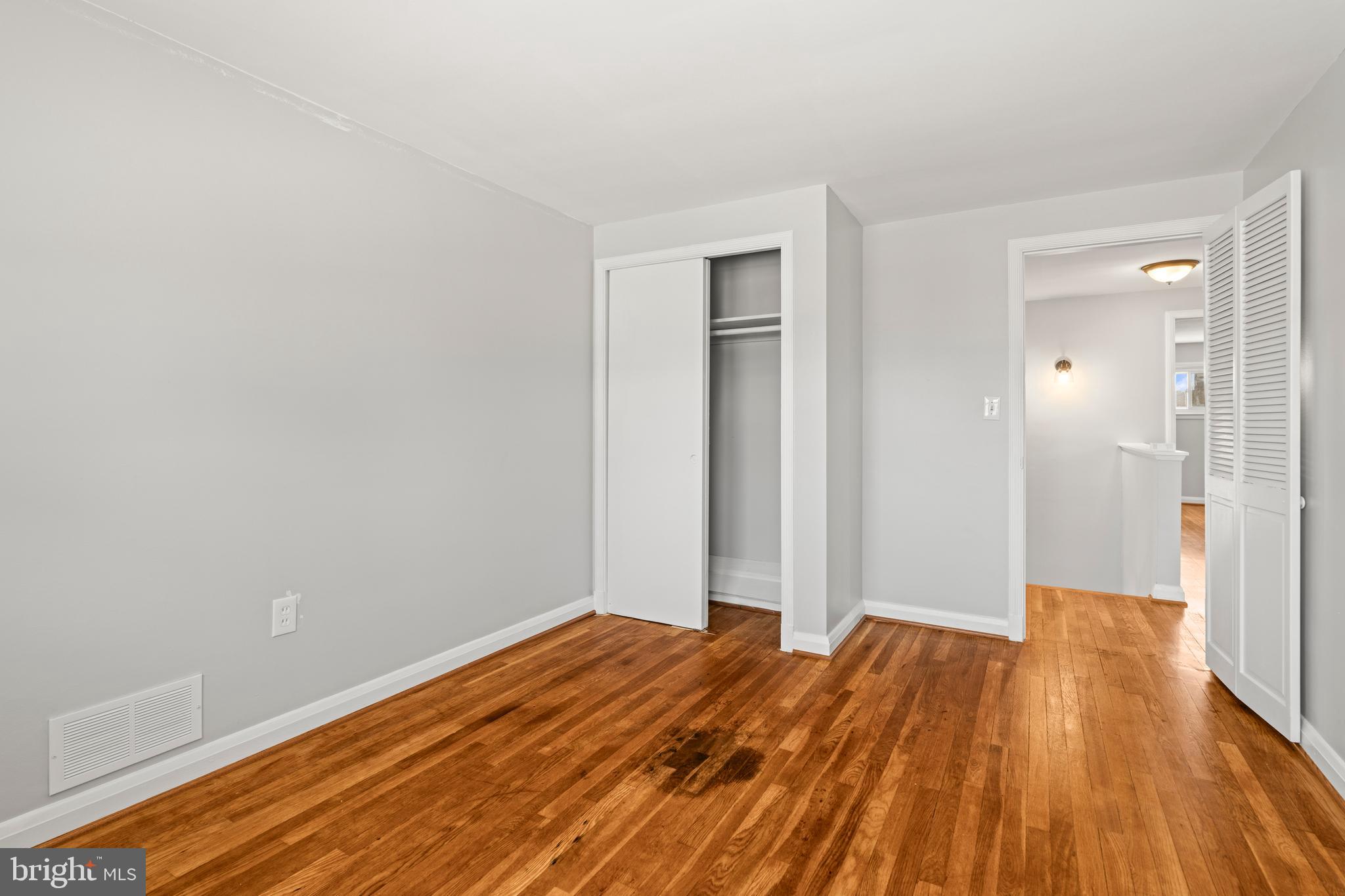 1407 Shefford Road Baltimore, MD 21239 - Photo 21 of 35 a view of a room with wooden floor and bathroom