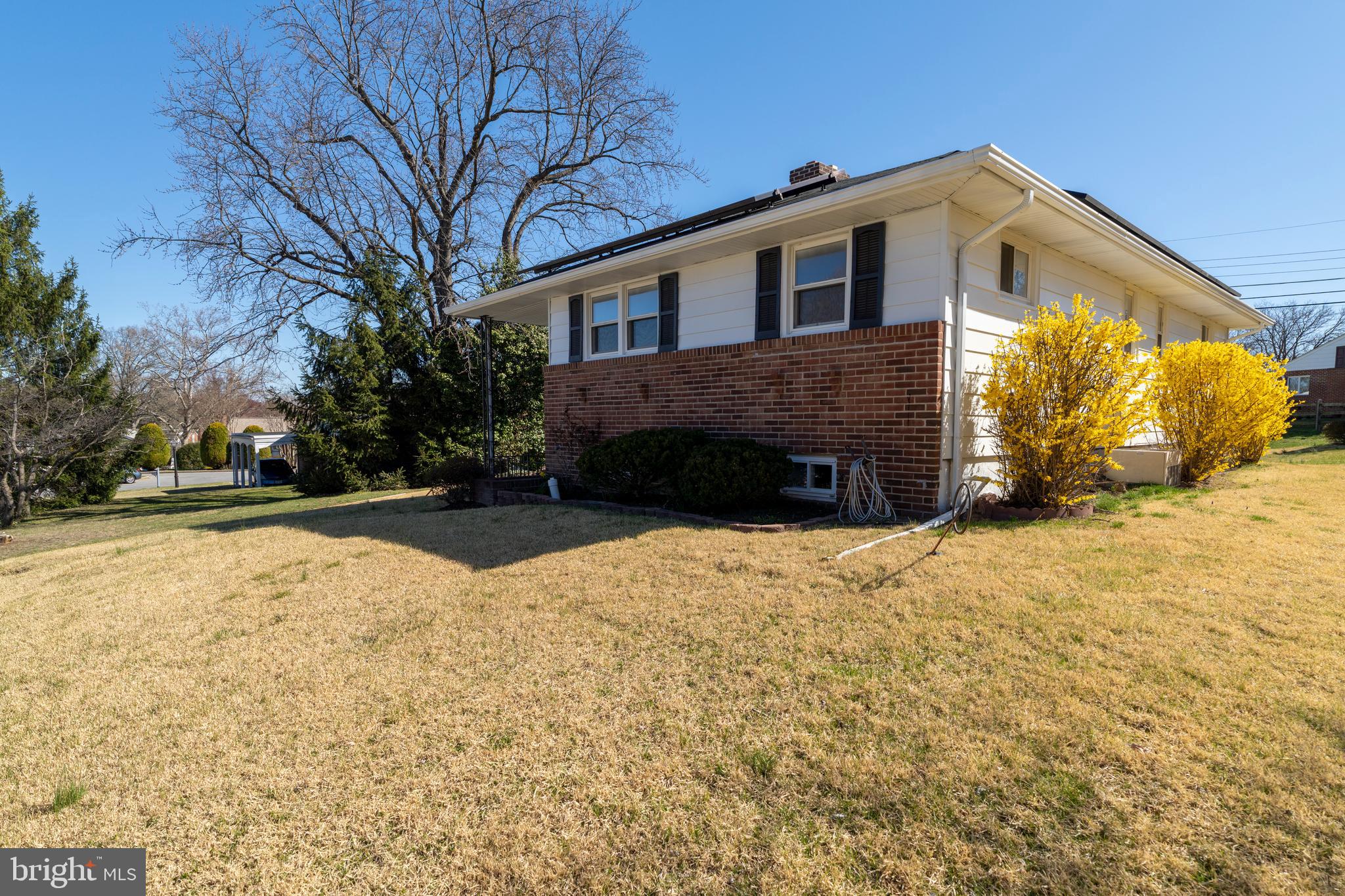 1407 Shefford Road Baltimore, MD 21239 - Photo 33 of 35 a front view of a house with yard and covered with snow