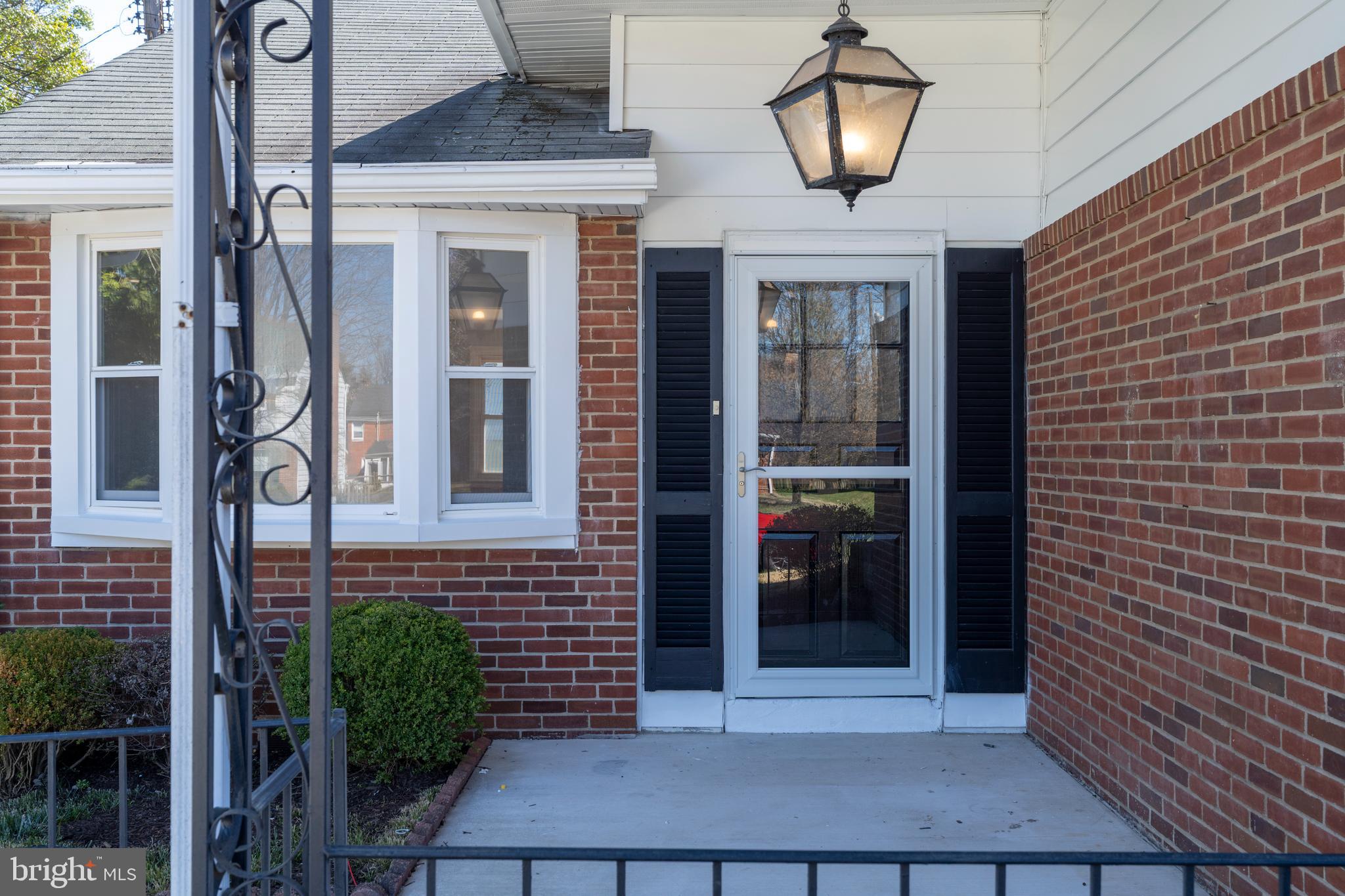 1407 Shefford Road Baltimore, MD 21239 - Photo 4 of 35 a front view of a house with a yard