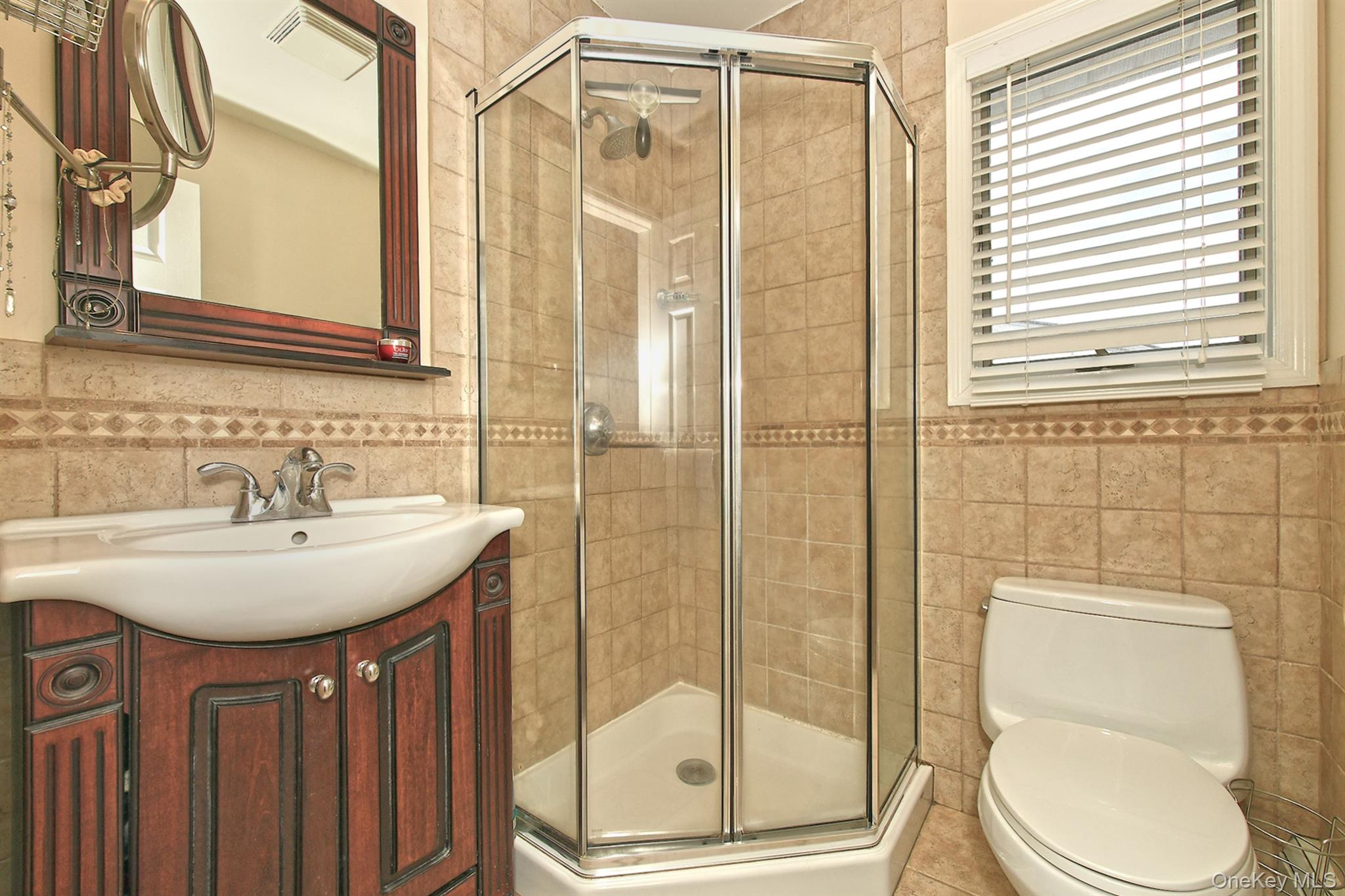 1968 Cynthia Lane Merrick, NY 11566 - Photo 17 of 32 a bathroom with a sink toilet and shower