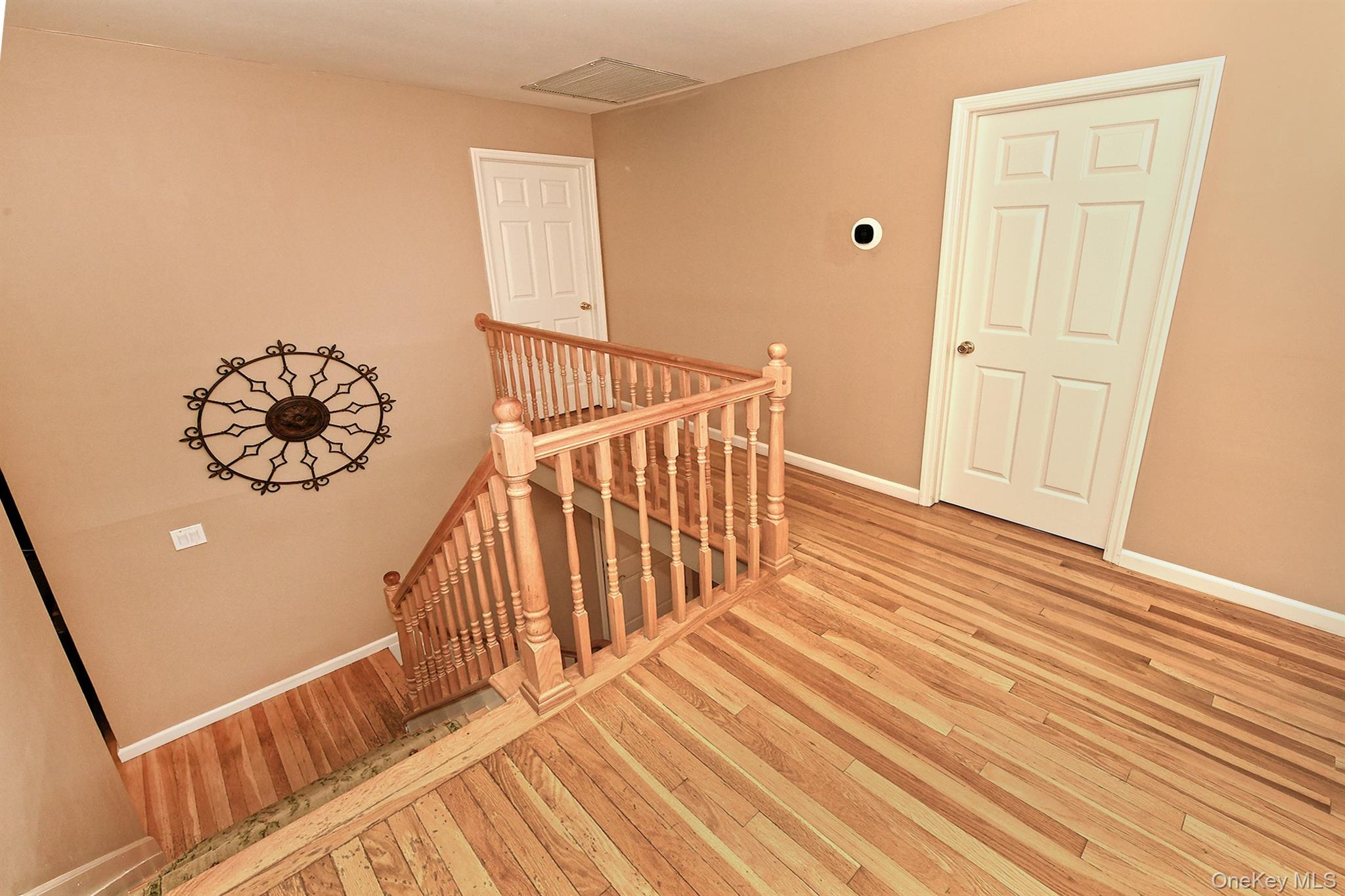 1968 Cynthia Lane Merrick, NY 11566 - Photo 23 of 32 a view of a hallway with wooden floor