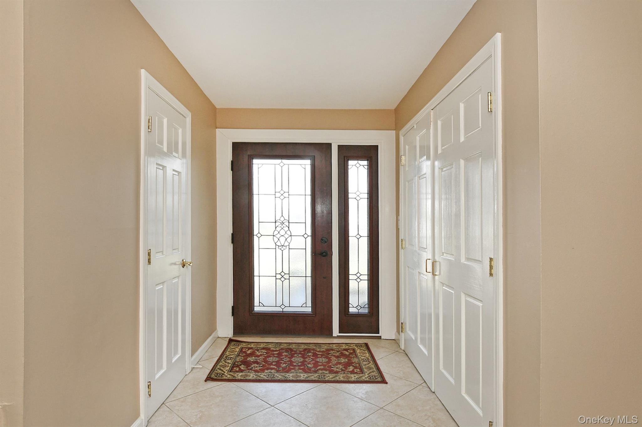 1968 Cynthia Lane Merrick, NY 11566 - Photo 4 of 32 a view of a hallway with windows