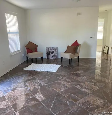 a view of a workspace with furniture