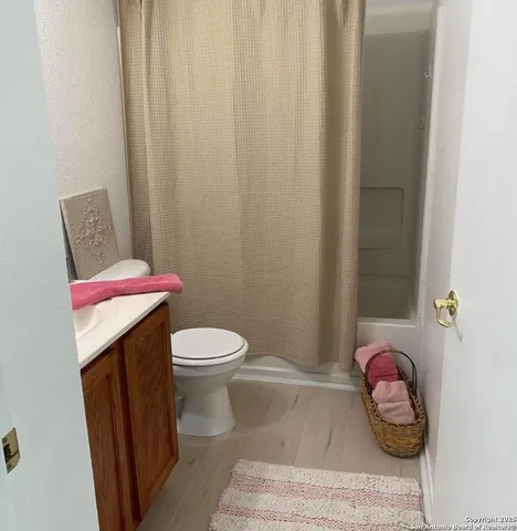 a bathroom with a bathtub and a sink