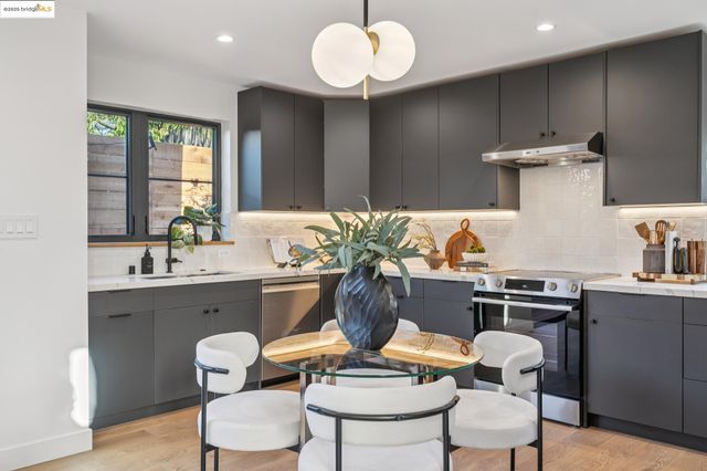a kitchen with a sink and a stove
