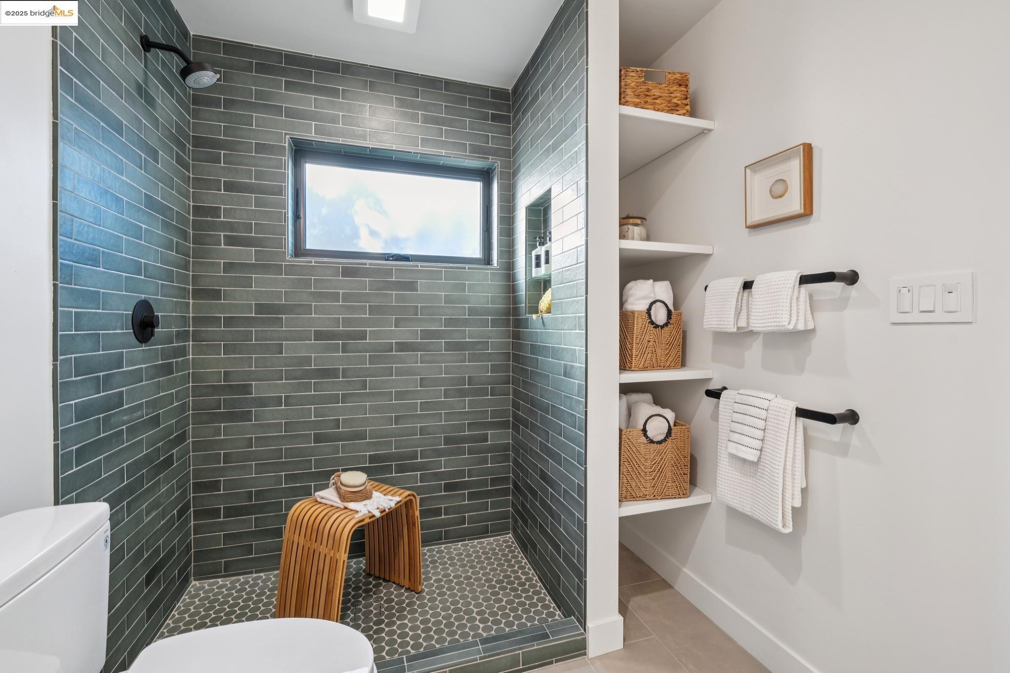 1516 A Blake Street Berkeley, CA 94703 - Photo 22 of 55 a bathroom with a toilet a sink and mirror