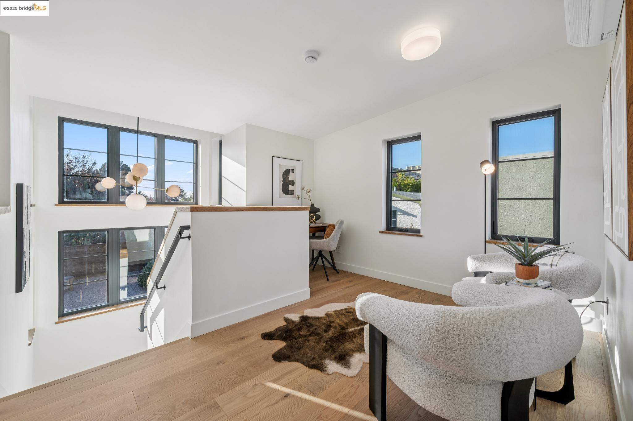 1516 A Blake Street Berkeley, CA 94703 - Photo 29 of 55 a living room with furniture and a large window