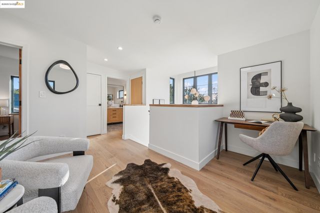 a bathroom with a sink a large mirror and a bathtub