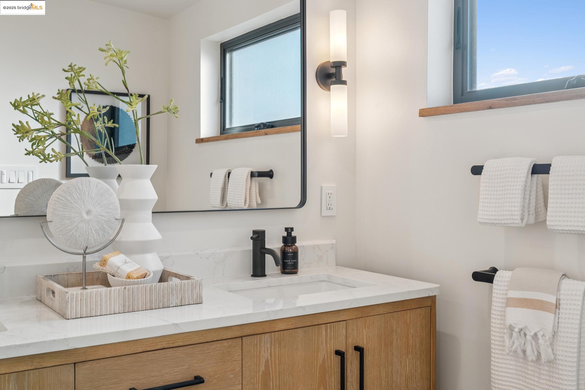 1516 A Blake Street Berkeley, CA 94703 - Photo 36 of 55 a bathroom with a sink and a mirror