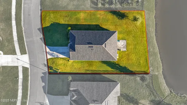 an aerial view of a house with swimming pool