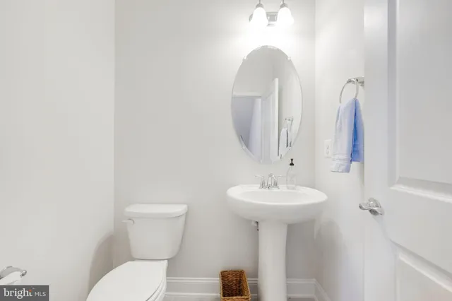 a spacious bedroom with a bed and a large window