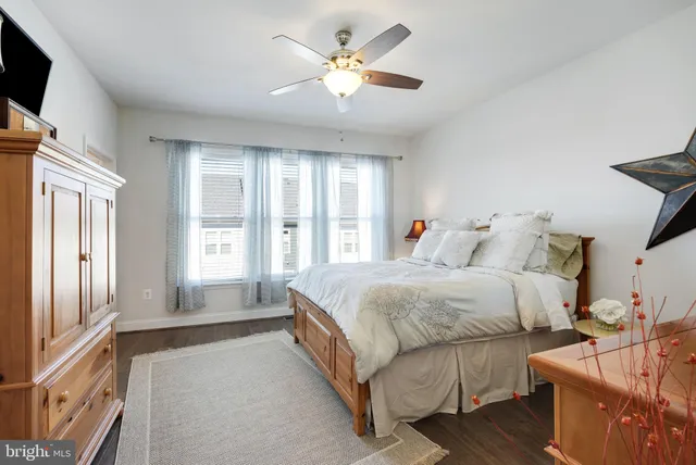 a bathroom with a granite countertop sink mirror and shower