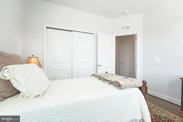a bathroom with a double vanity sink toilet and shower