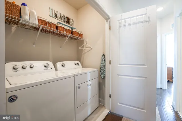 a view of a balcony with couch and wooden floor