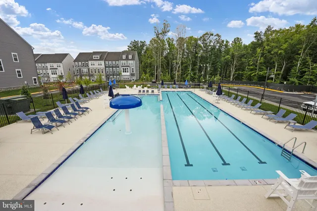 a view of a patio with swimming pool table and chairs